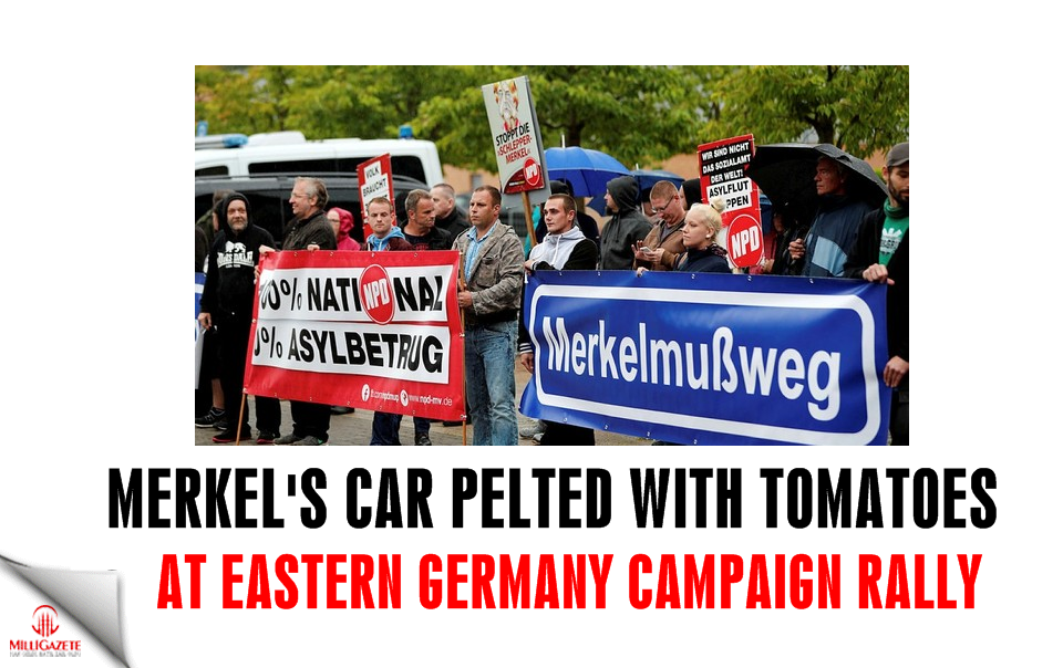 Merkel's car pelted with tomatoes at eastern Germany campaign rally
