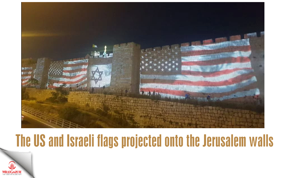 The US and Israeli flags projected onto the Jerusalem walls