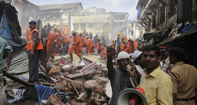 At least 9 dead, dozens trapped after building collapses in India's Mumbai