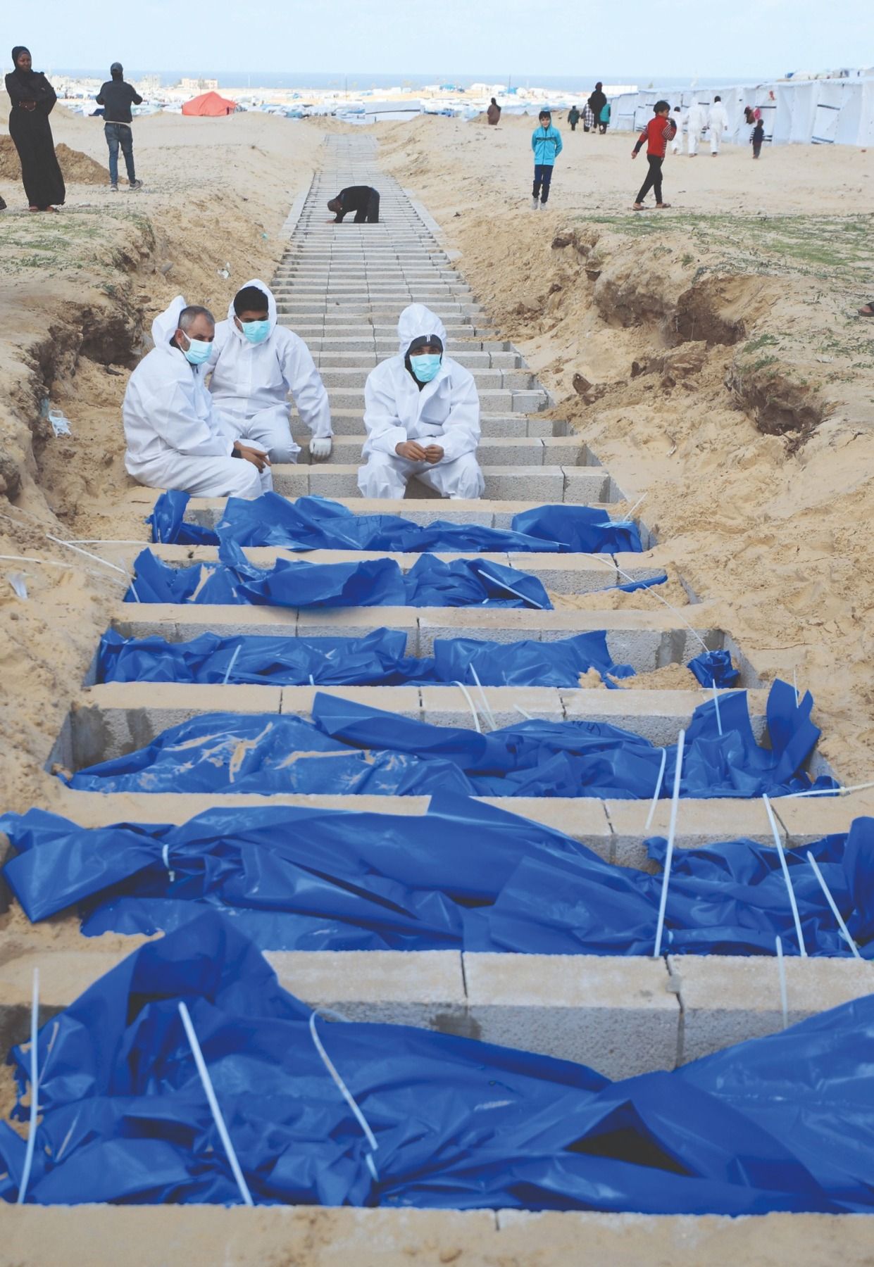 Bodies of 100 slain Palestinians stolen by Israeli forces in Gaza buried in mass grave
