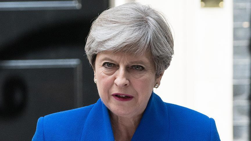 British MPs approve May government's first policy plans