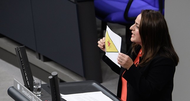 German lawmaker sparks criticism after displaying banned YPG flag in parliament