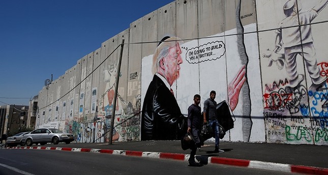 Graffiti of Trump resembling Banksy work surfaces on West Bank barrier